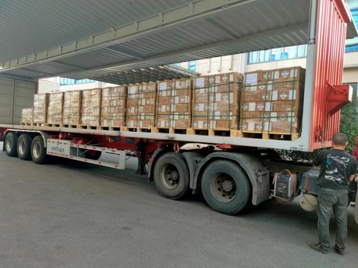 containers of lithium cells  loaded on to trucks for export after receiving millions of pre-payment